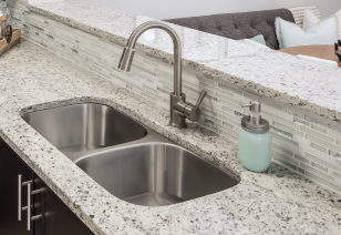 Close view of kitchen bar top counter with double sink at MAA South Park luxury apartments in Charlotte, NC