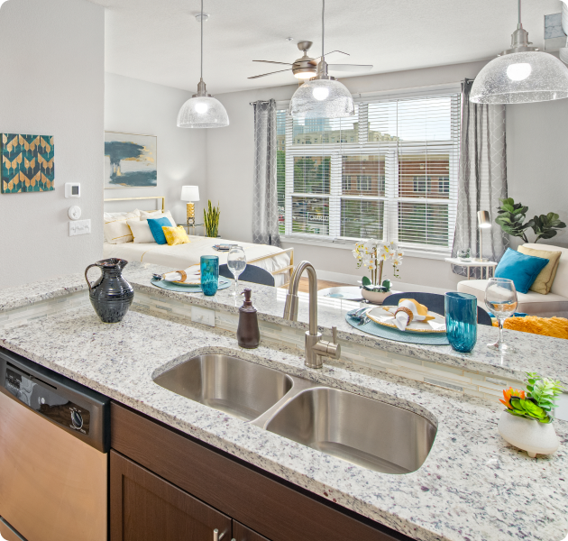 Apartment living and dining area with multiple sitting areas at MAA Uptown luxury apartments in Charlotte, NC