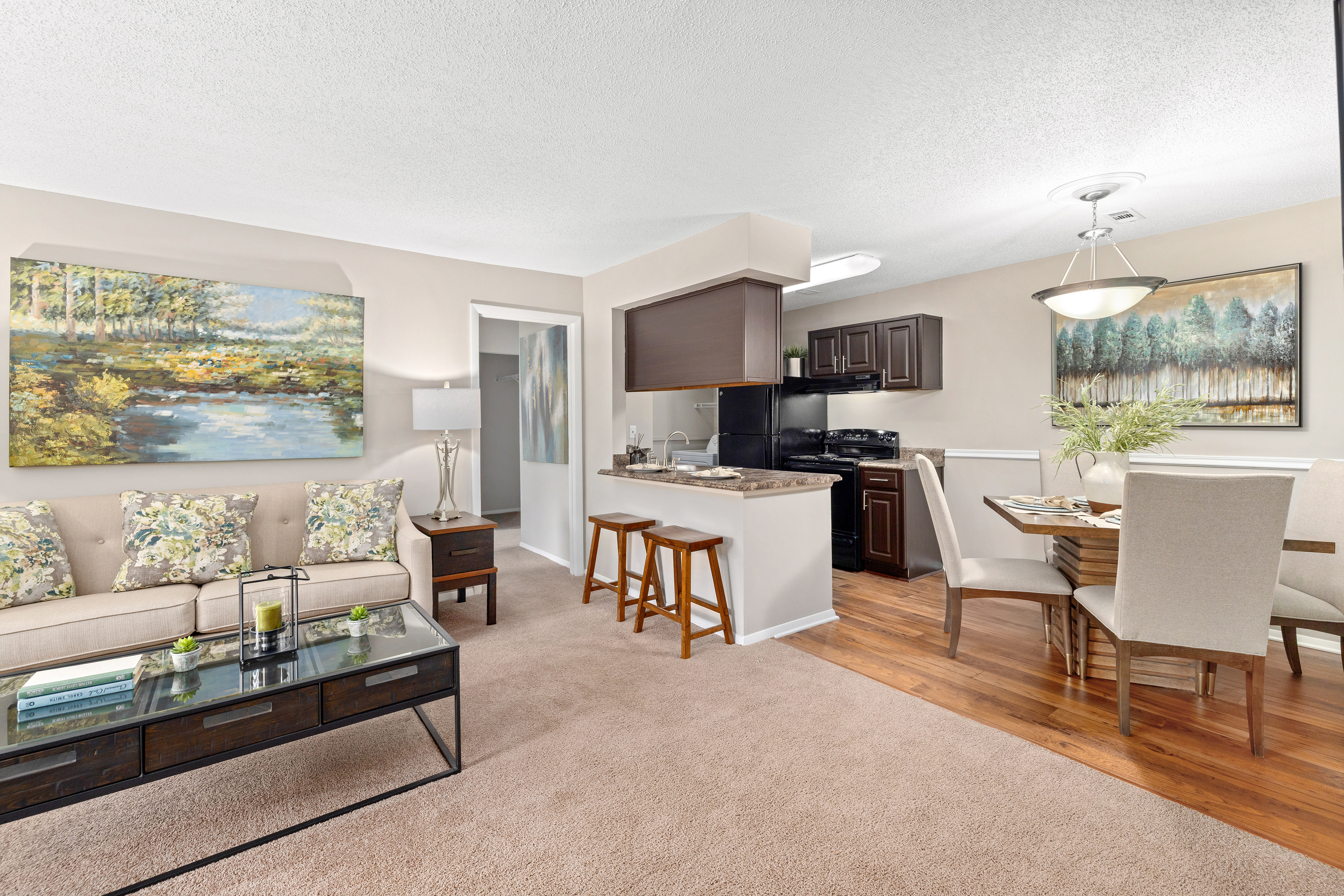Model - Living room, dining room and kitchen  -  at MAA Westchase luxury apartment homes in Charleston, SC