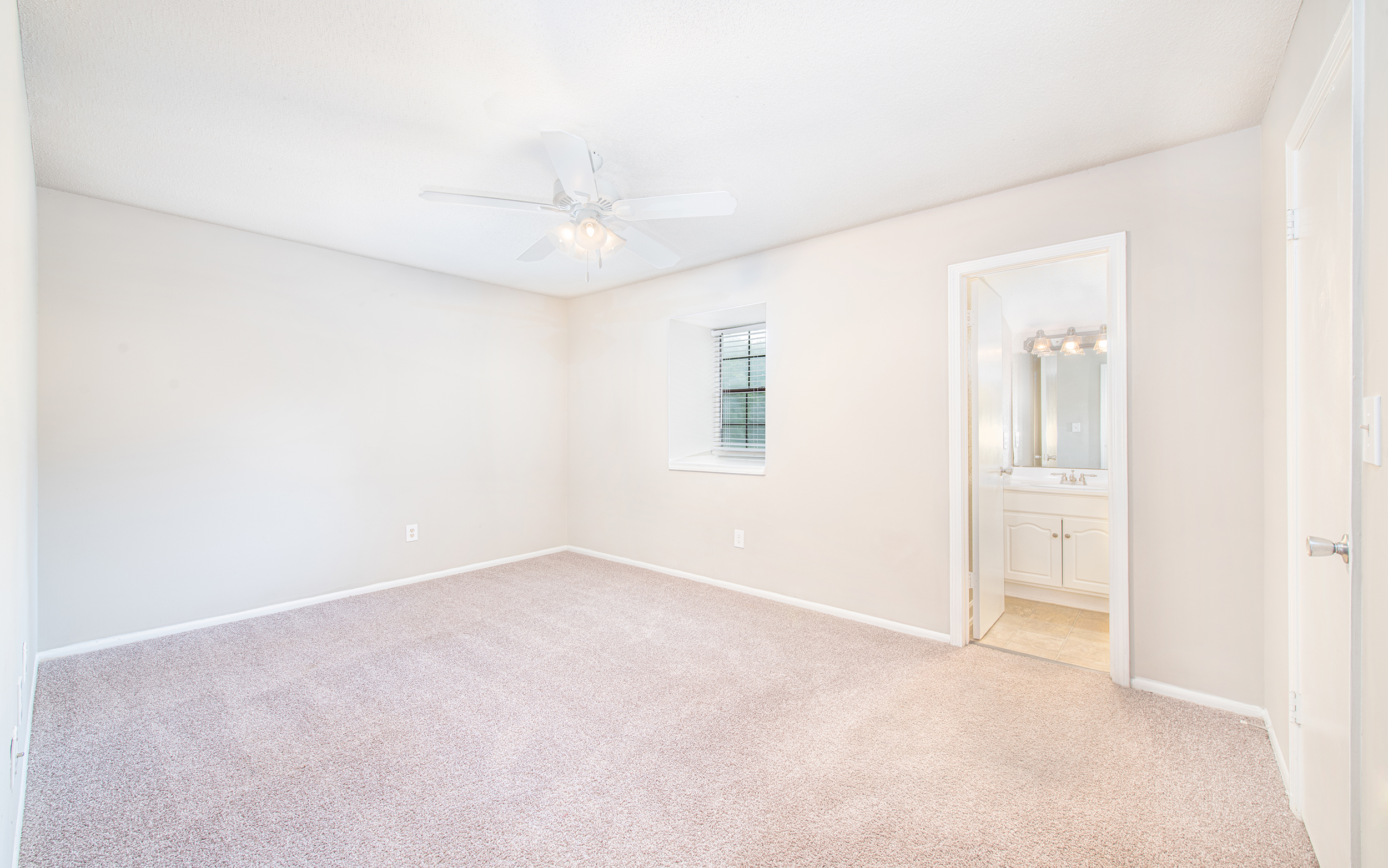 Bedroom with en suite bathroom at MAA Spring Creek luxury apartment homes in Greenville, SC