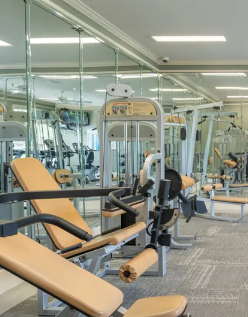 Fitness center with variety of workout equipment next to a mirrored wall at MAA Sam Ridley luxury apartments in Smyrna, TN