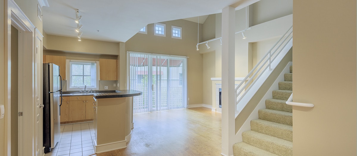 Kitchen and living room at MAA Abbey luxury apartment homes in Dallas, TX