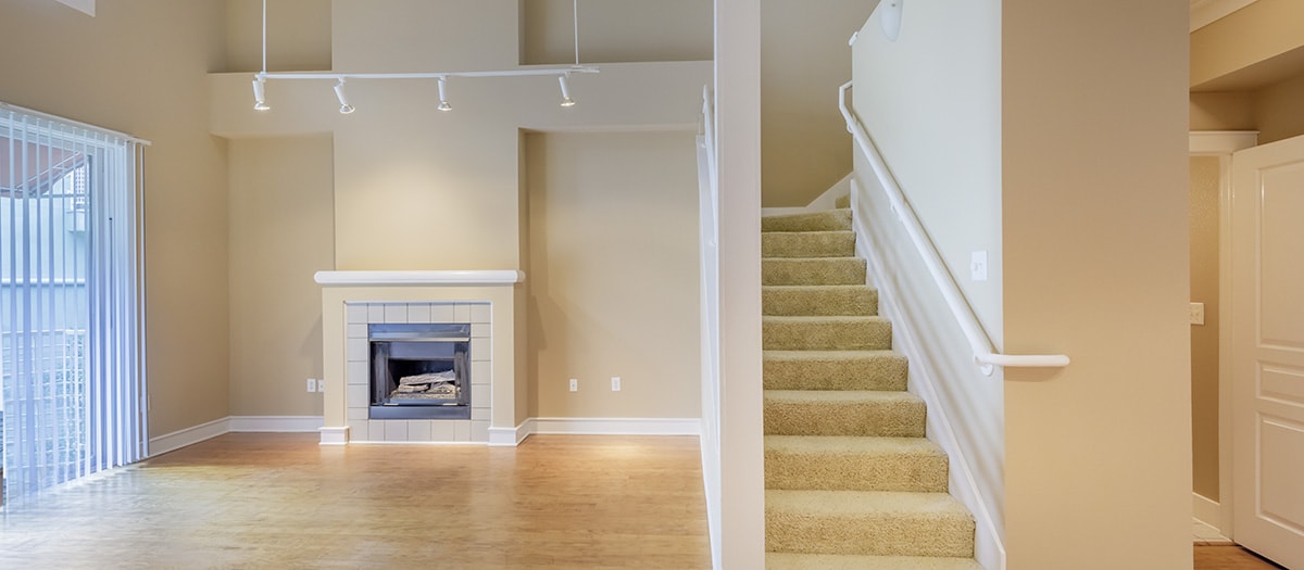 Living room with fireplace at MAA Abbey luxury apartment homes in Dallas, TX