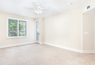 A open space bedroom with carpet and a ceiling fan at MAA Abbey luxury apartments in Dallas, TX