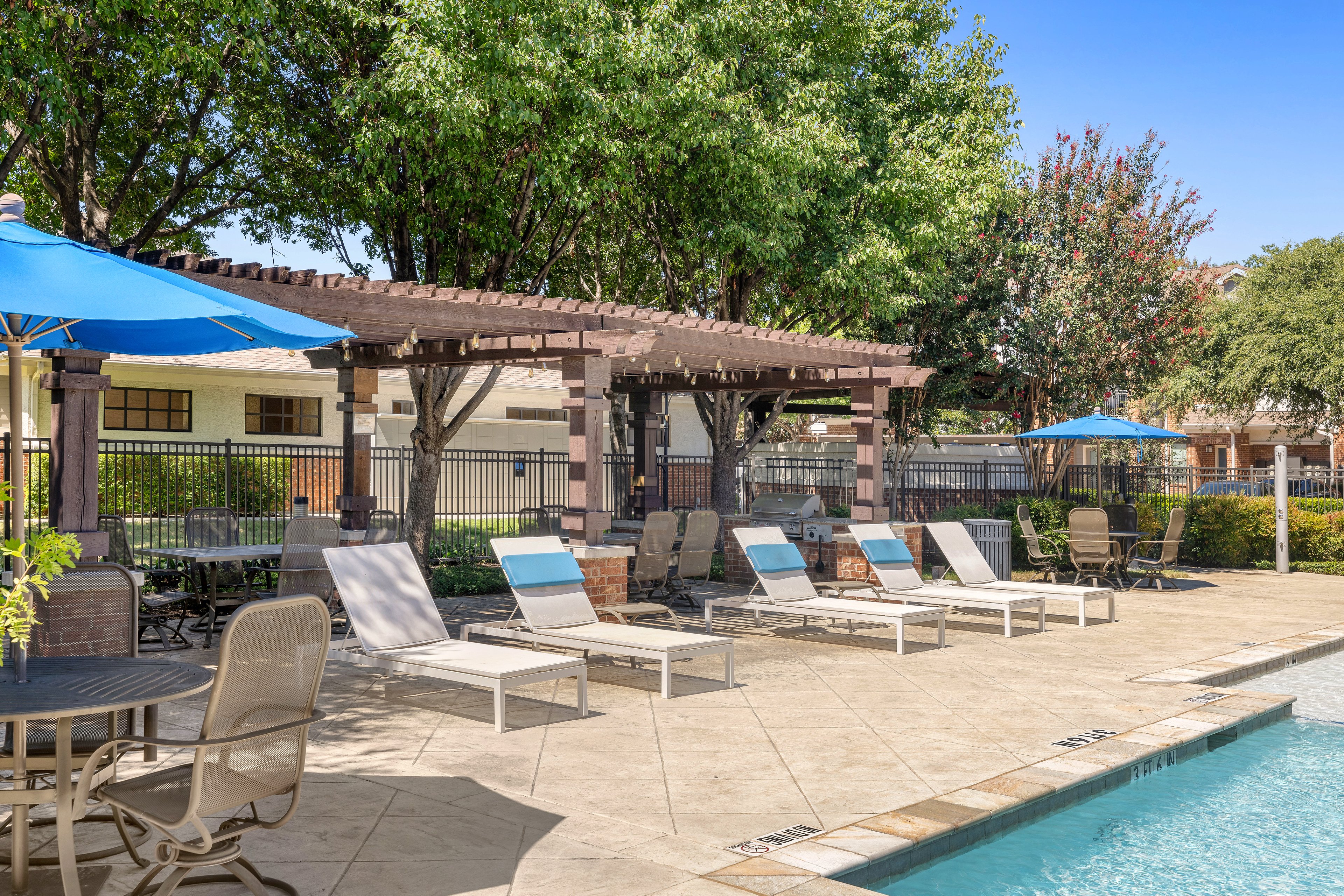 Pool seating at MAA Copper Ridge luxury apartment homes in Roanoke, TX