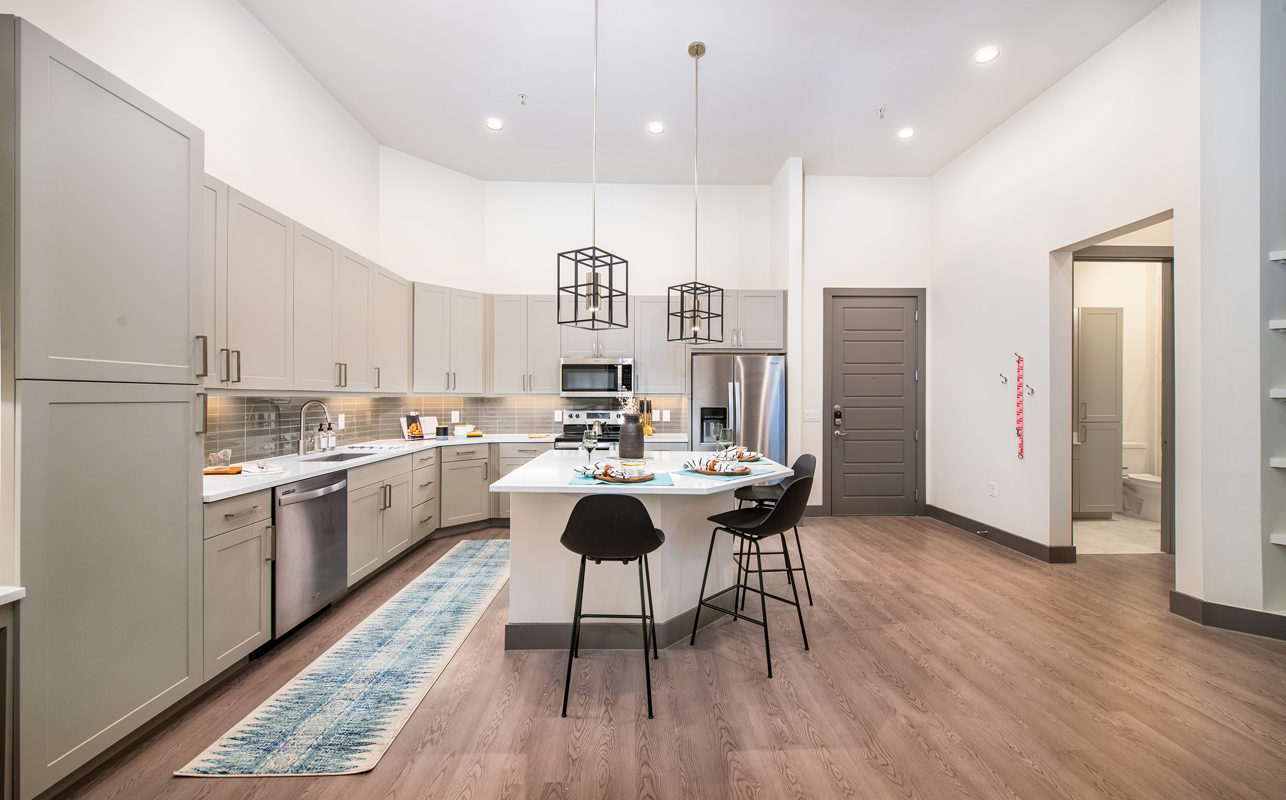 Kitchen and dining at MAA Frisco Bridges luxury apartment homes in Dallas, TX