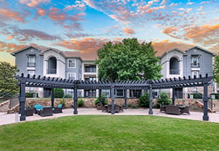 Poolside covered patio with lounge seating areas at MAA Starwood luxury apartments in Frisco, TX