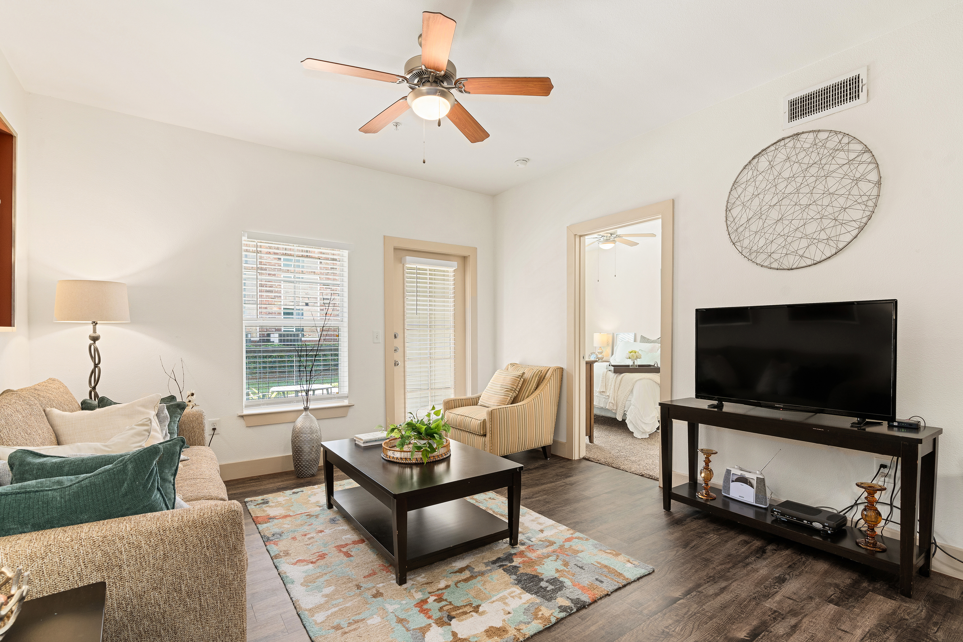 Living room at MAA Grand Cypress luxury apartment homes in Cypress, TX