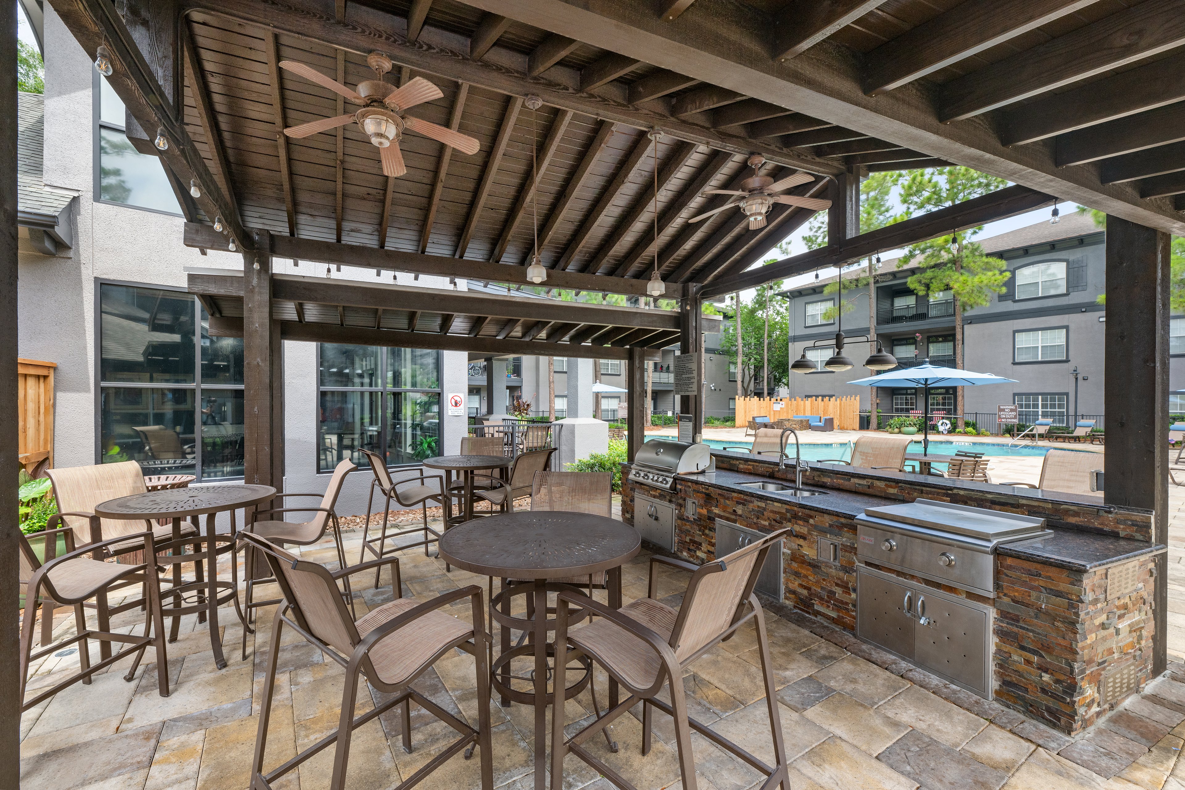 Pool grilling at MAA Legacy Pines luxury apartment homes in Houston, TX