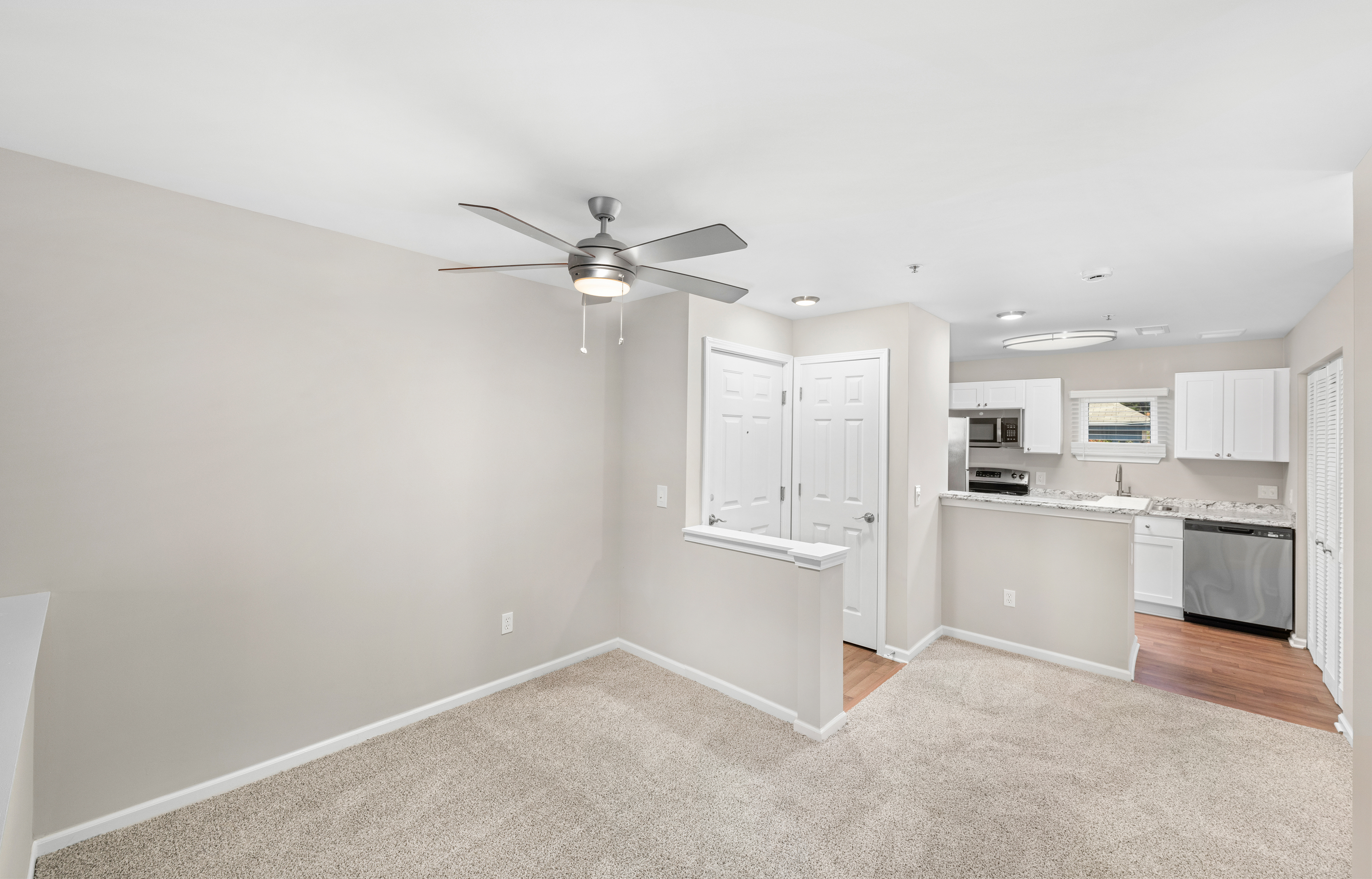 Model - Living room and kitchen -  at MAA Pavilion Place luxury apartment homes in Richmond, VA