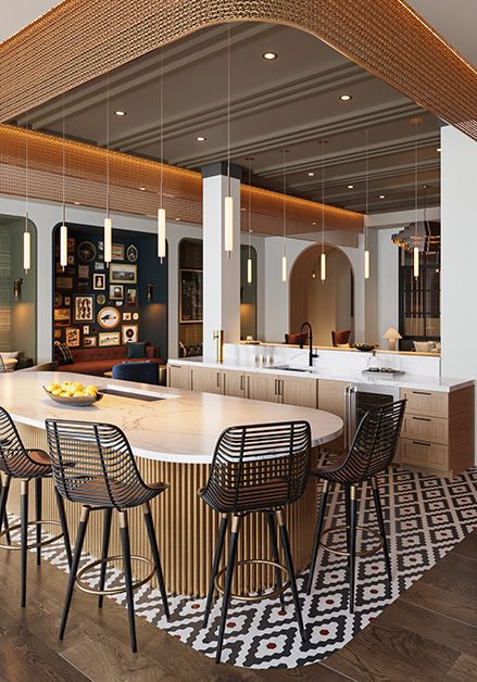 Modern clubhouse with a large communal table and woven chairs on a patterned rug, pendant lighting and a stylish seating areas on wood floors at MAA Rove luxury apartments in Richmond, VA