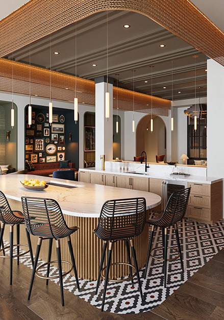 Modern clubhouse with a large communal table and woven chairs on a patterned rug, pendant lighting and a stylish seating areas on wood floors at MAA Rove luxury apartments in Richmond, VA