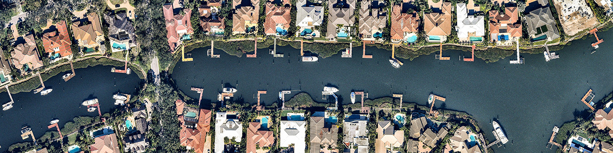 Aerial views of houses on a canal