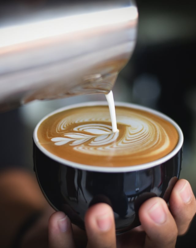 Man walking to a marooned boat