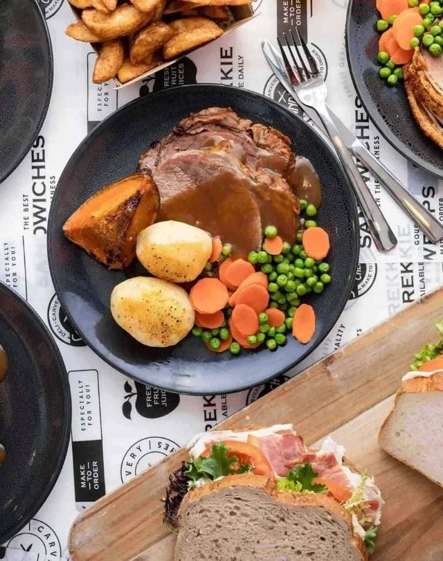 Man walking to a marooned boat
