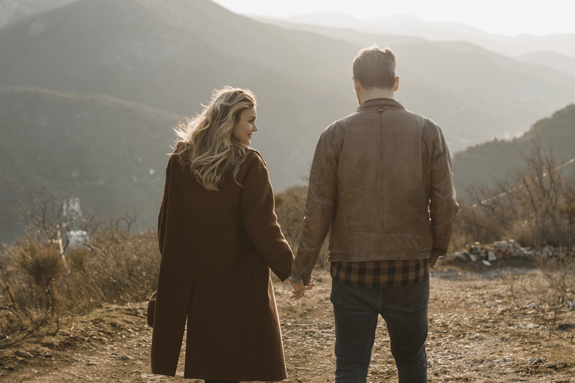 Couple holding hands and walking