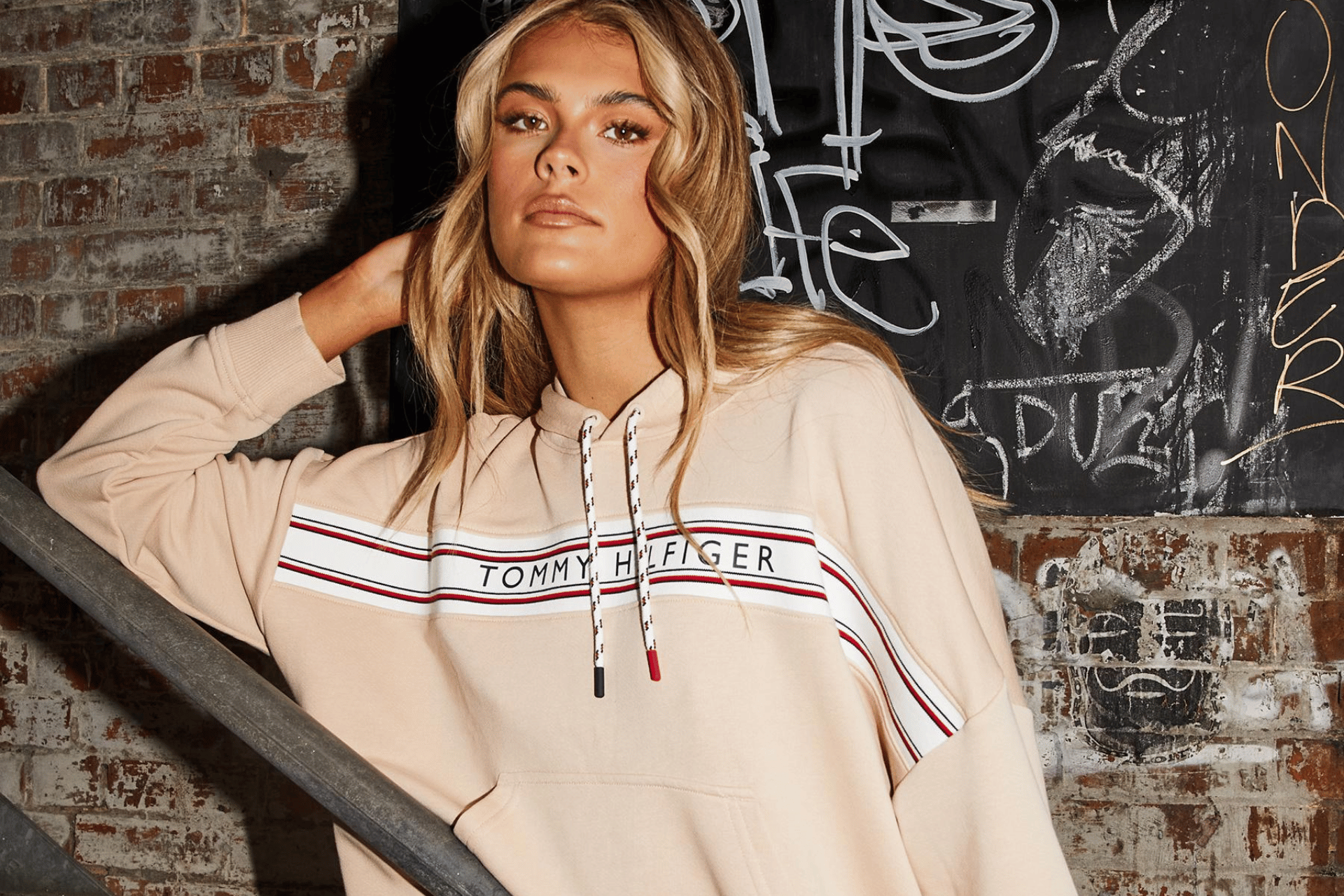 Woman wearing hoodie from City Beach