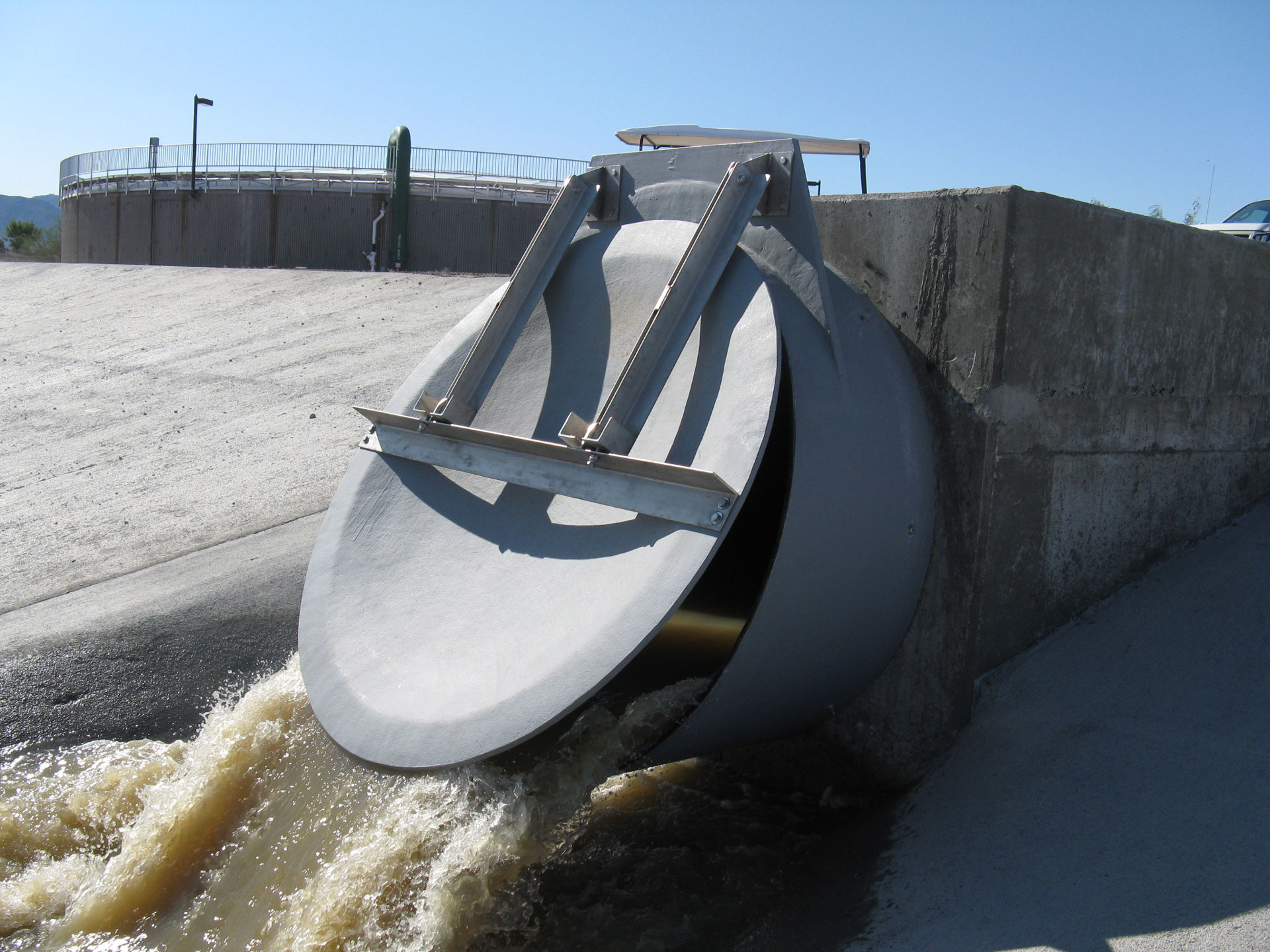 Flap gate in use with water rushing out