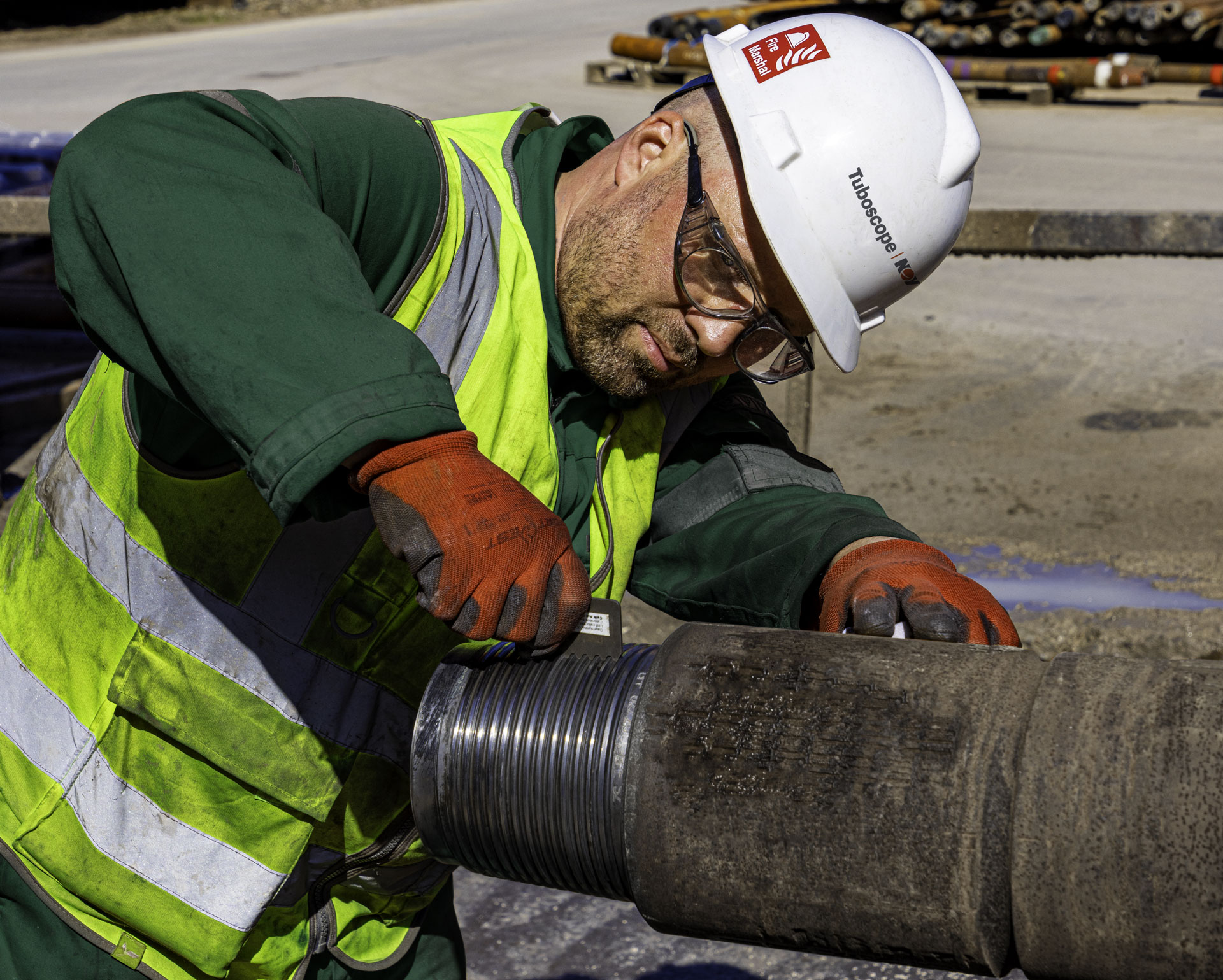 Technician working on Delta Prime pipe wearing PPE