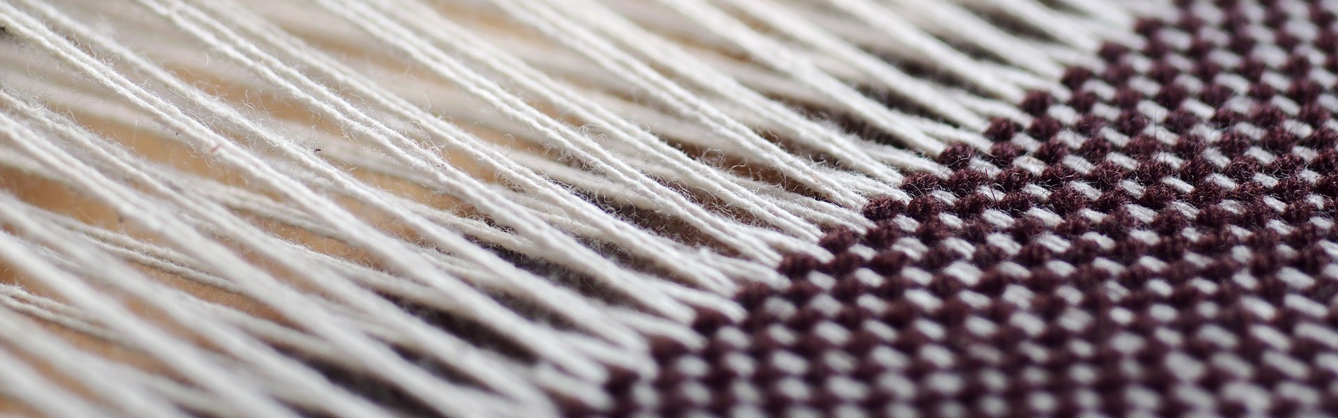Air filtration for textile weaving processes