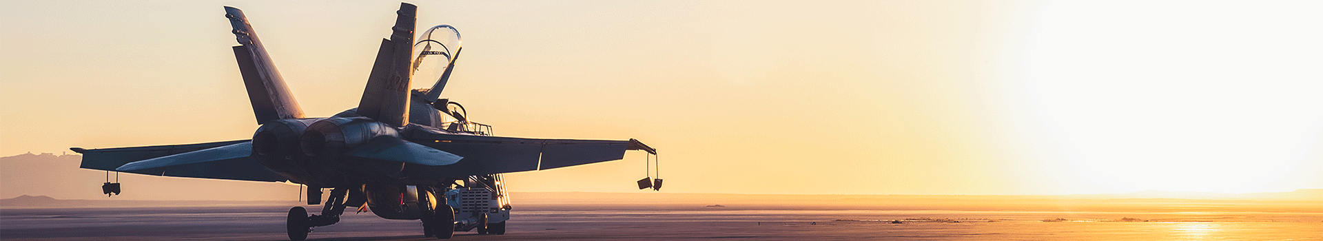 Military aircraft in sunrise