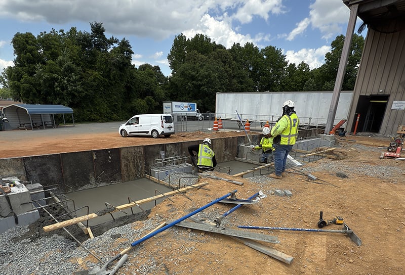 Construction workers building the new docks for Nordfab's XD plan expansion in May 2025