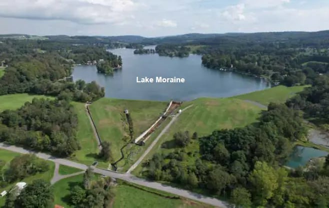 An aerial view of the Madison Reservoir Dam with Lake Moraine labeled.