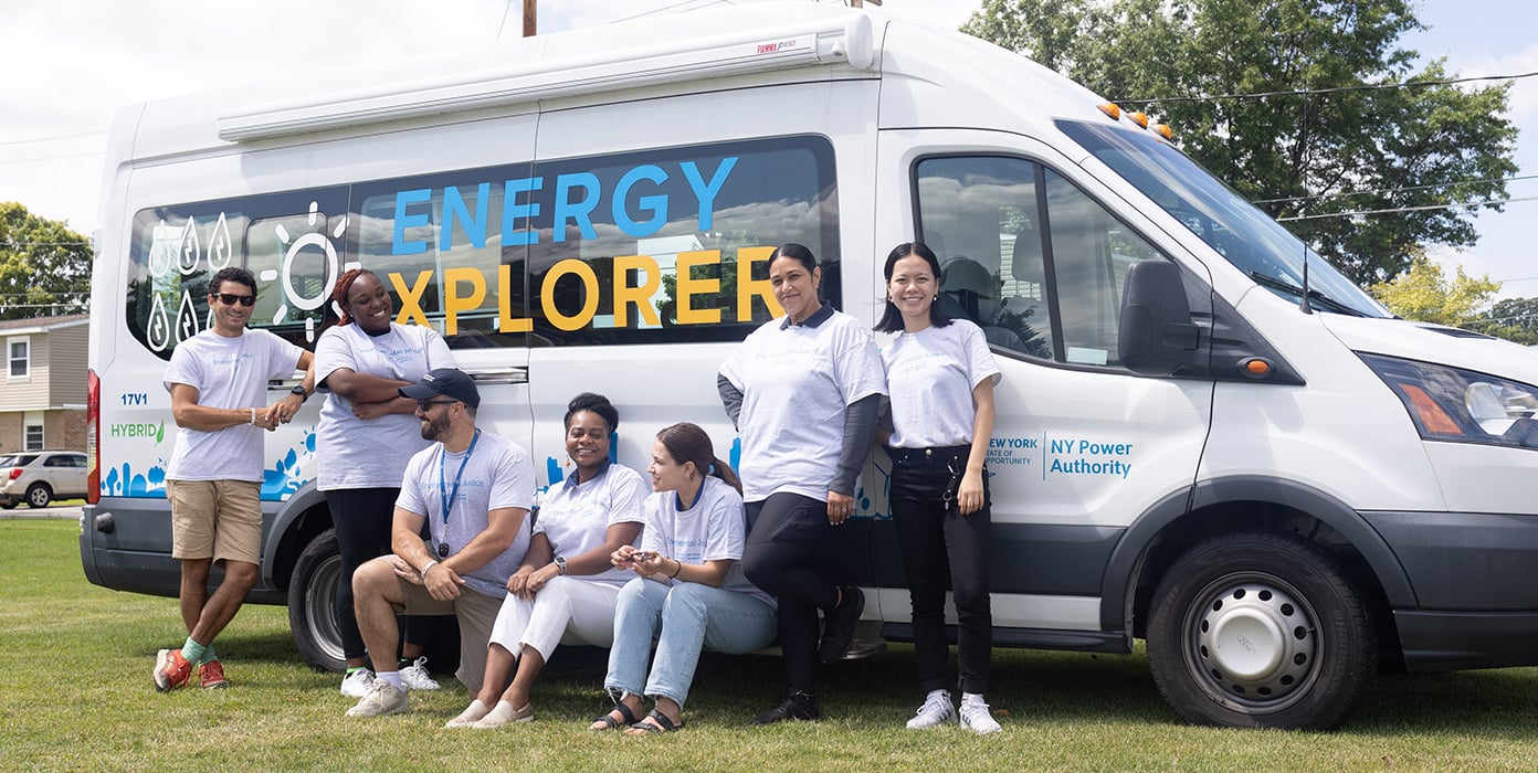NYPA Team posing with VAN having a logo of Energy Explorer at NYPA