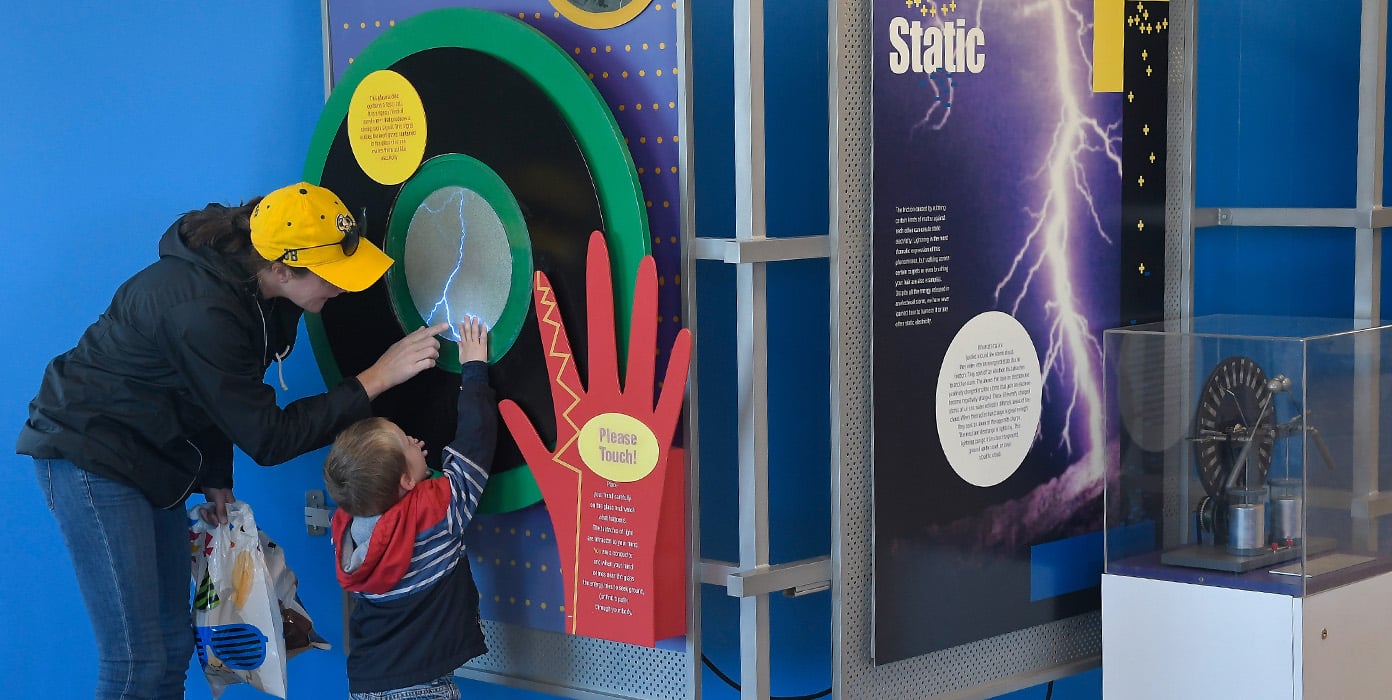 A lady with kid exploring NYPA visiors centers