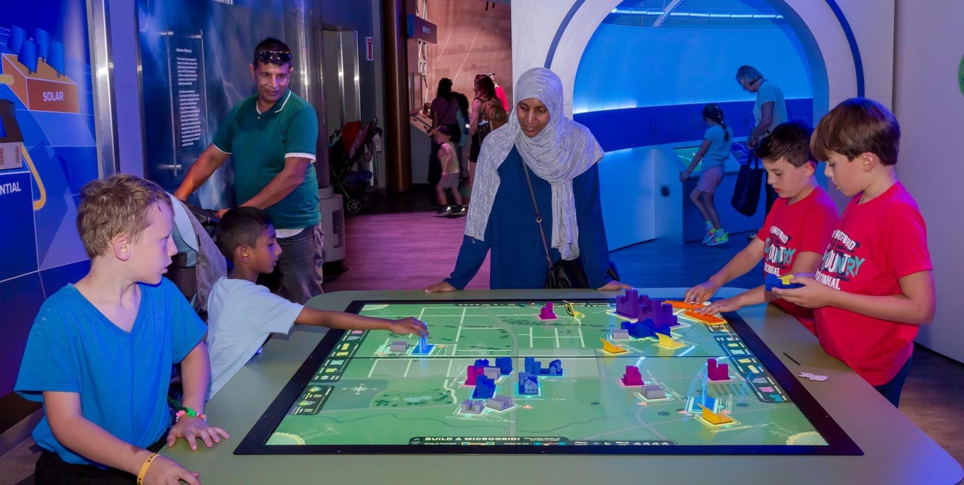Children exploring Digital map under Energy Zone campus