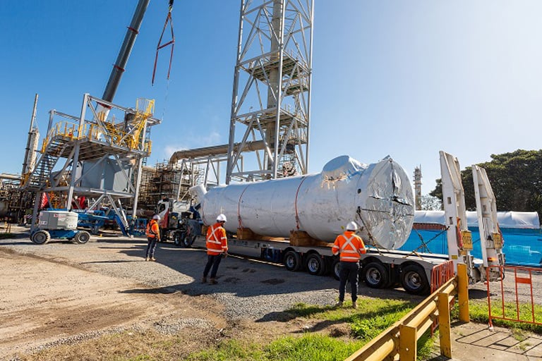 reactor being delivered by truck on a site