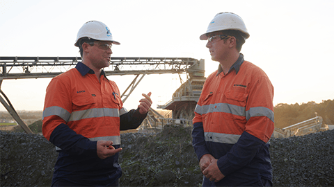 Two drill and blast engineers collaborating on site