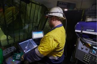 An engineer in an underground mine using BlastIQ Mobile