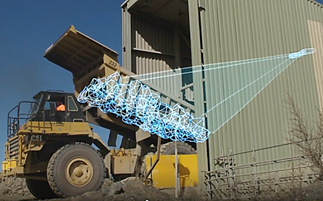 A dump truck with a digital overlay showcasing how FRAGTrack is used to capture sampling during a tipping operation