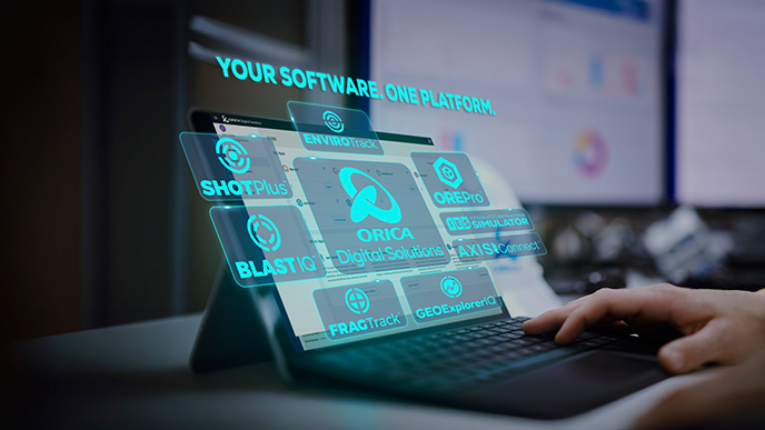 Orica digital software platform interface displayed on a tablet beside a laptop