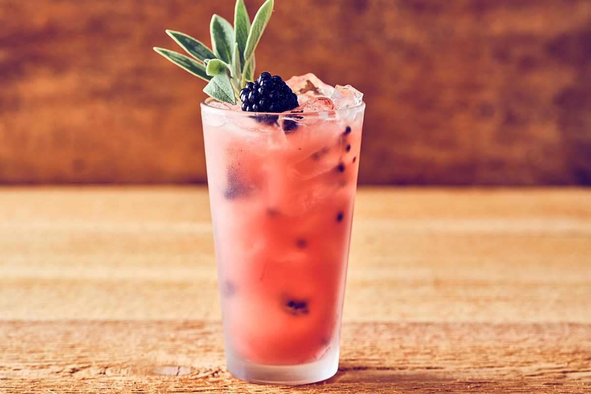 BLACKBERRY BRAMBLE (SPIRIT-FREE) A refreshing blend of shaken blackberries, orange juice, house-made sour mix and sage syrup, finished with blackberries and a sage sprig.