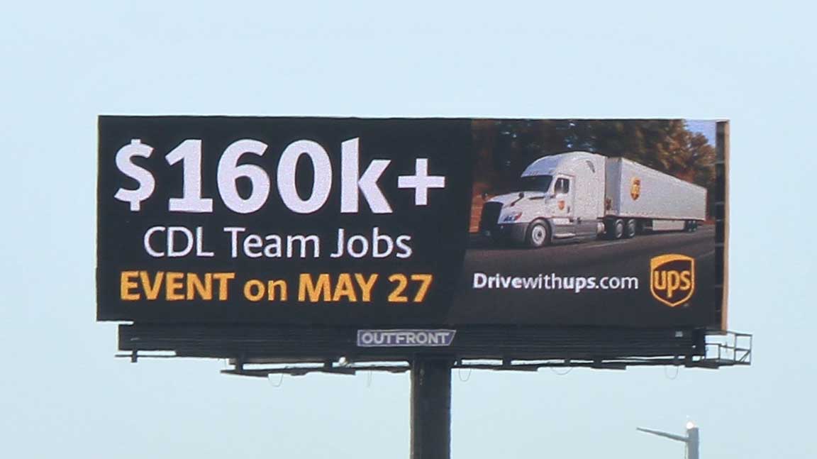 UPS hiring event billboard advertising $160k+ CDL team jobs
