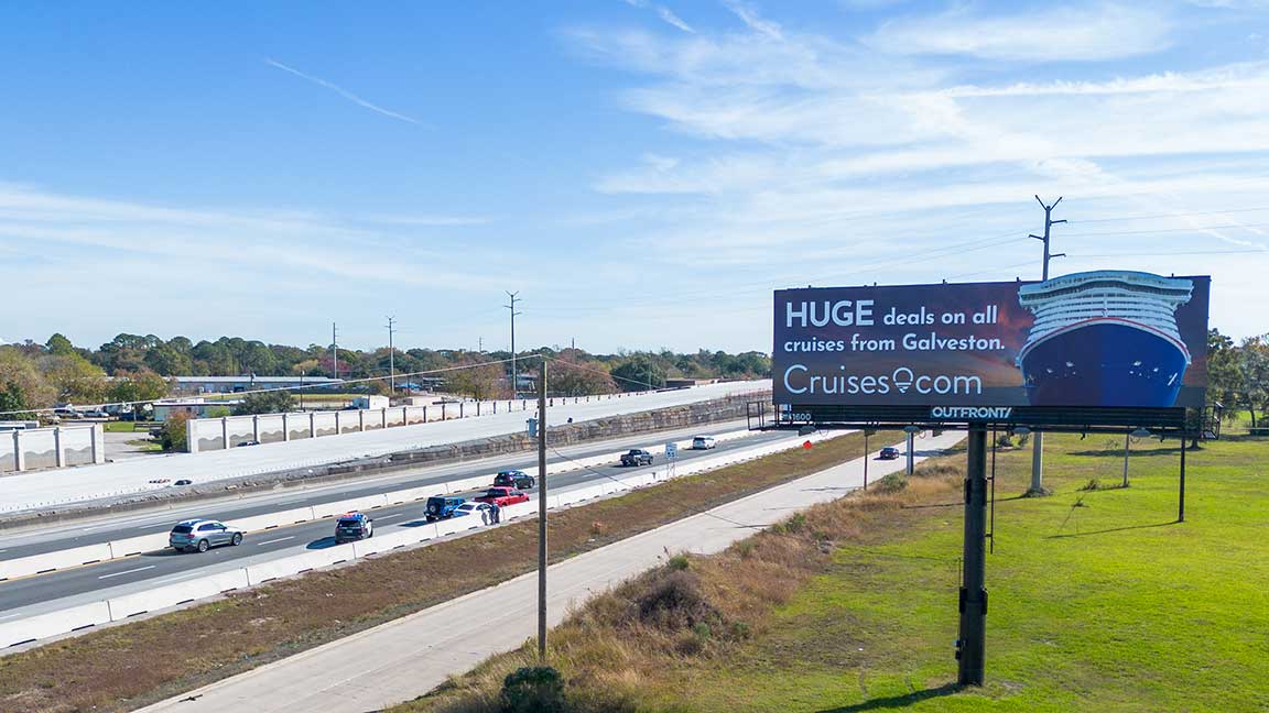 Cruises.com billboard on second side of interstate gateway