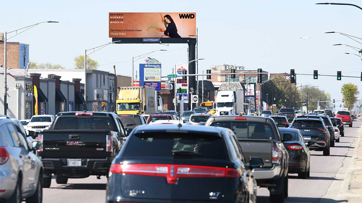 Billboard for OUTFRONT x Women's Wear Daily Hispanic Heritage Month campaign