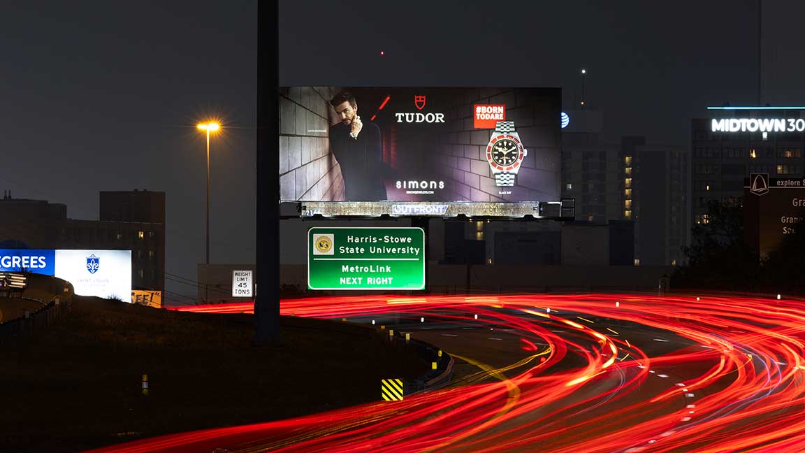 OUTFRONT bulletin billboard along St. Louis highway at night