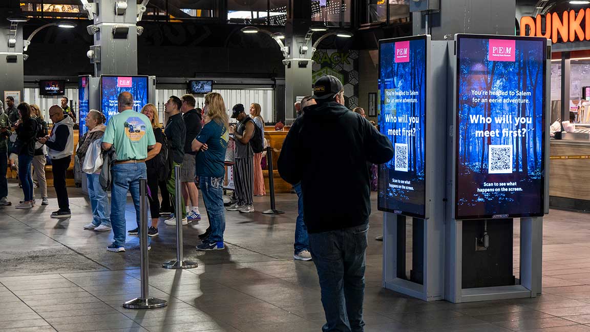 Peabody Essex Museum campaign on Boston subway liveboards with QR code in creative