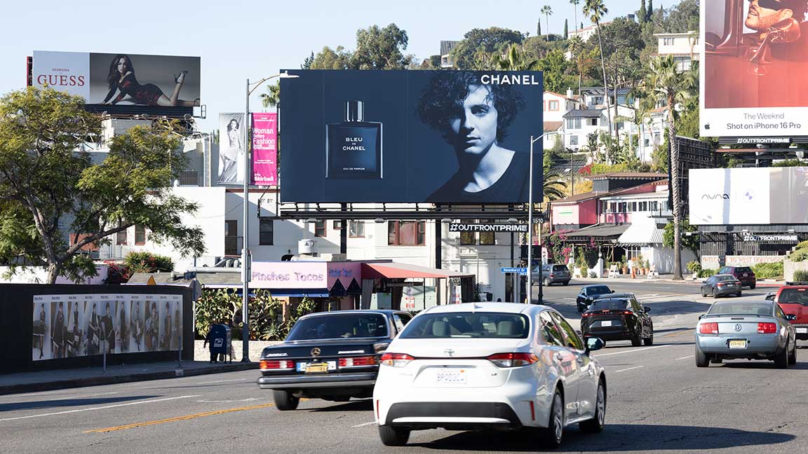 Timothée Chalamet in Chanel advertisement on OUTFRONT PRIME billboard on Sunset Strip in Los Angeles