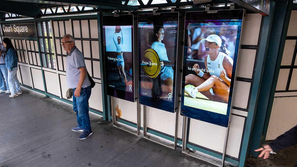 OnRunning digital Liveboard triptych at Court Square subway station in NYC during US Open