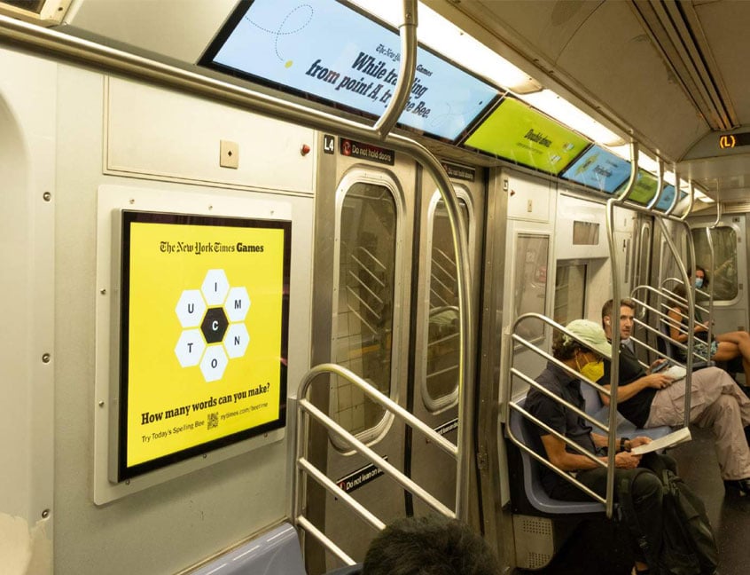 out of home transit subway advertising new york times spelling bee gaming