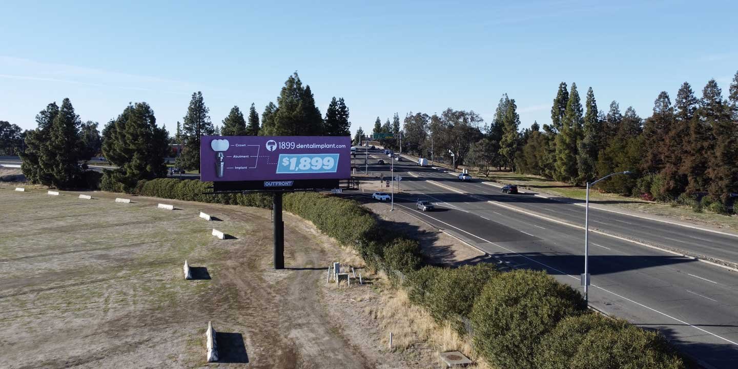 out of home billboard advertising for dental implants in sacramento