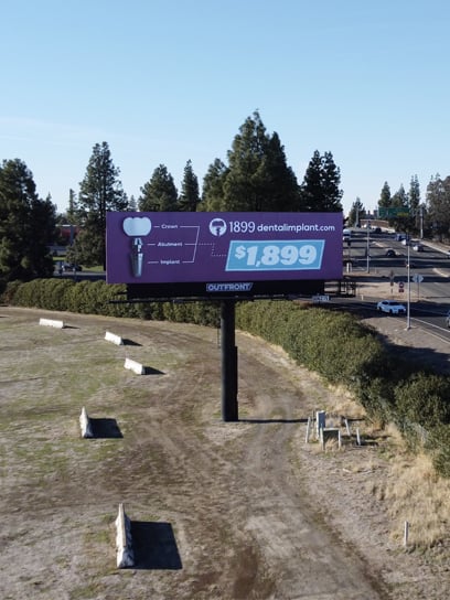 out of home billboard advertising for dental implants in sacramento
