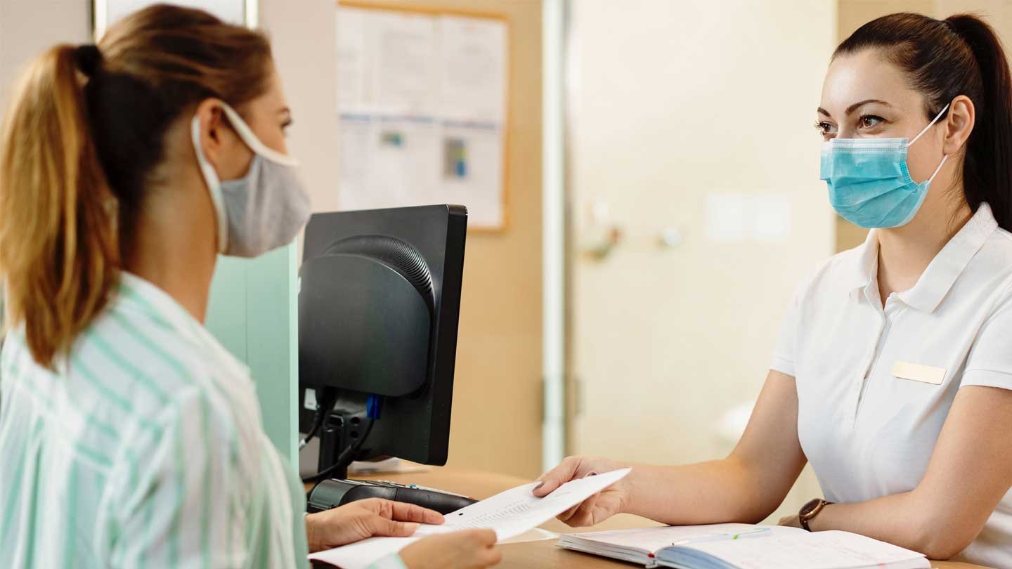 stock photo of receptionist and patient