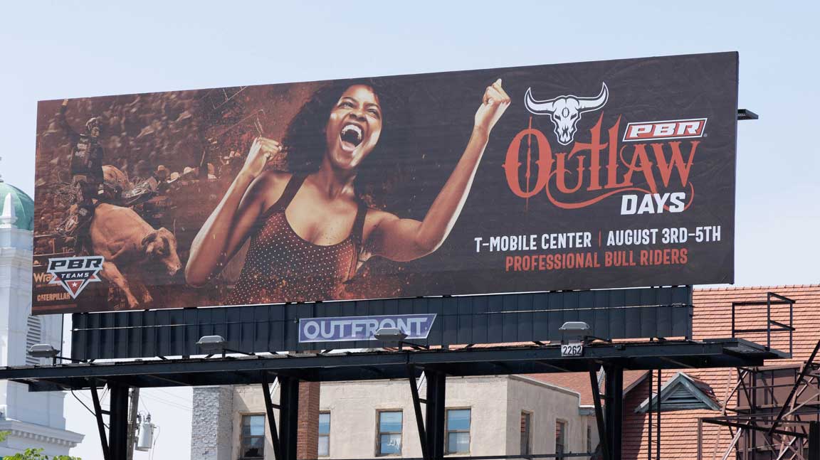 PBR Teams Outlaw Days billboard in Kansas City with cheering woman