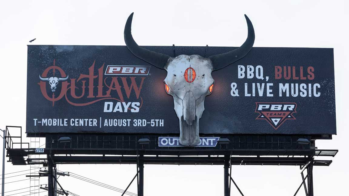 PBR Teams Outlaw Days billboard in Kansas City with billboard extensions, 2D pop-outs, and lighting effects.