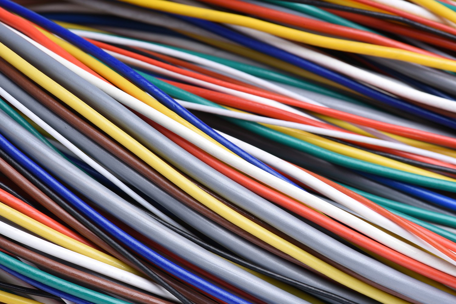 A close-up image of multicolored wires, showcasing various hues and intricate patterns, symbolizing connectivity and technological sophistication.